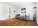 Stylish living room with a sofa, hardwood floors, and modern decor at 10200 Windalier Way, Roswell, GA 30076
