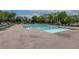 A tranquil pool view featuring lounge seating and a clear, inviting swimming space at 10200 Windalier Way, Roswell, GA 30076