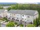 Elegant townhomes offering private balconies, garage parking, and beautifully landscaped surroundings at 10200 Windalier Way, Roswell, GA 30076