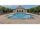 A large community pool surrounded by lounge chairs, perfect for relaxation and leisure in a luxurious setting at 10200 Windalier Way, Roswell, GA 30076