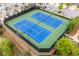 Aerial view of community tennis courts with blue and green surface, surrounded by trees and parking at 10200 Windalier Way, Roswell, GA 30076