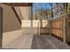 Private back porch area with wood flooring and privacy fence at 3135 Seven Pines Ct # 101, Atlanta, GA 30339