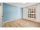 Bedroom features new flooring and large window at 3135 Seven Pines Ct # 101, Atlanta, GA 30339