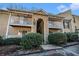 A beautiful multi-level condo building with stone facade, balconies, and mature landscaping at 3135 Seven Pines Ct # 101, Atlanta, GA 30339