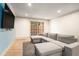 Bright living room featuring a comfortable gray sectional sofa and sliding door to the outside at 3135 Seven Pines Ct # 101, Atlanta, GA 30339