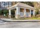 Mailbox structure with stone column accents and mature landscaping at 3135 Seven Pines Ct # 101, Atlanta, GA 30339