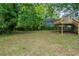 Lush backyard with a partial view of the raised deck, and fenced property at 3140 Delowe Dr, Atlanta, GA 30344