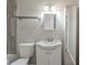 Bathroom featuring a white vanity with storage, tiled shower, and a modern mirror with lighting at 3140 Delowe Dr, Atlanta, GA 30344