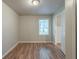 Bedroom with neutral paint, hardwood floors and a window at 3140 Delowe Dr, Atlanta, GA 30344