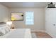Cozy staged bedroom featuring hardwood floors and a door at 3140 Delowe Dr, Atlanta, GA 30344
