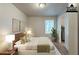 Bright bedroom featuring neutral tones, hardwood floors, and a large window offering ample natural light at 3140 Delowe Dr, Atlanta, GA 30344