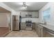 Updated kitchen with stainless steel appliances, granite countertops, tile floors, and subway tile backsplash at 3140 Delowe Dr, Atlanta, GA 30344