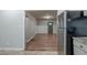 Spacious kitchen with gray cabinets and stainless steel appliances, adjacent to an open-concept living area at 3140 Delowe Dr, Atlanta, GA 30344