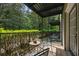 Private covered balcony with relaxing wooded views is perfect for entertaining at 3472 Essex Ave # 81, Atlanta, GA 30339