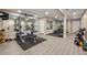 Well equipped home gym and workout space in basement, includes various weight machines and workout equipment at 3472 Essex Ave # 81, Atlanta, GA 30339