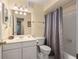This bright bathroom includes shower-tub combo and modern vanity at 3472 Essex Ave # 81, Atlanta, GA 30339