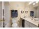 Bright bathroom featuring a large mirror, vanity, and shower-tub combo at 3472 Essex Ave # 81, Atlanta, GA 30339