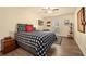 Bright bedroom features a ceiling fan, wood-look flooring, and a window at 3472 Essex Ave # 81, Atlanta, GA 30339