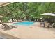 Resort-style community pool surrounded by lounge chairs and lush landscaping, a perfect relaxation spot at 3472 Essex Ave # 81, Atlanta, GA 30339