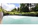 Community tennis court with lush green surroundings, perfect for an active lifestyle at 3472 Essex Ave # 81, Atlanta, GA 30339