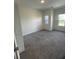 Spacious bedroom features new carpet, two windows, and fresh paint at 4011 Redan Rd # 8, Stone Mountain, GA 30083