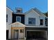 New construction townhome showcasing modern farmhouse elements and spacious garages at 4011 Redan Rd # 8, Stone Mountain, GA 30083