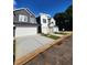 Two-story home with a gray exterior and white garage door at 4011 Redan Rd # 8, Stone Mountain, GA 30083