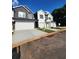 Two-story home with a gray exterior and white garage door at 4011 Redan Rd # 8, Stone Mountain, GA 30083