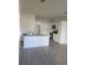 Bright kitchen with white cabinets and a large island at 4011 Redan Rd # 8, Stone Mountain, GA 30083