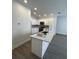 Well-equipped kitchen boasts a marble island, stainless steel appliances, and ample counter space at 4011 Redan Rd # 8, Stone Mountain, GA 30083