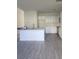 Bright kitchen with white cabinets and a large island at 4011 Redan Rd # 8, Stone Mountain, GA 30083