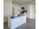 Bright kitchen with white cabinets and a large island at 4011 Redan Rd # 8, Stone Mountain, GA 30083