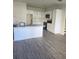 Bright kitchen with white cabinets and a large island at 4011 Redan Rd # 8, Stone Mountain, GA 30083