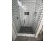 A shower stall with black and white tiled walls at 4011 Redan Rd # 8, Stone Mountain, GA 30083