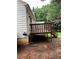 Backyard exterior shot of a home featuring a wooden deck at 1047 Plantation Way, Kennesaw, GA 30301