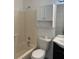 Full bathroom features a shower and tub combination and large vanity mirror with overhead cabinets at 1047 Plantation Way, Kennesaw, GA 30301
