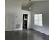 Bright living room with vaulted ceilings, ceiling fan, hardwood floors, and view of kitchen at 1047 Plantation Way, Kennesaw, GA 30301