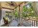 Relaxing covered balcony with wicker chair, ceiling fan, and string lights at 396 15Th Nw St # 6, Atlanta, GA 30318