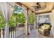 Cozy balcony area with outdoor seating, string lights, and a ceiling fan for relaxing outdoors at 396 15Th Nw St # 6, Atlanta, GA 30318