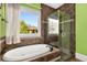 Modern bathroom features a soaking tub, and a glass-enclosed shower with tile surround at 396 15Th Nw St # 6, Atlanta, GA 30318