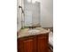 Bathroom featuring granite countertop vanity with a framed mirror and modern fixtures at 396 15Th Nw St # 6, Atlanta, GA 30318