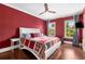Cozy bedroom featuring hardwood floors, a ceiling fan, and two windows with natural light at 396 15Th Nw St # 6, Atlanta, GA 30318