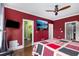 Spacious bedroom with a ceiling fan, hardwood floors, and stylish decor with a mounted television at 396 15Th Nw St # 6, Atlanta, GA 30318