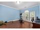 Versatile bonus room with natural light, wood floors, and home gym equipment at 396 15Th Nw St # 6, Atlanta, GA 30318
