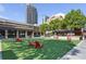 Inviting courtyard with Adirondack chairs on artificial turf for outdoor relaxation and enjoyment at 396 15Th Nw St # 6, Atlanta, GA 30318