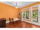 This dining room features wood floors, a window, and a door to the balcony at 396 15Th Nw St # 6, Atlanta, GA 30318