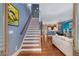 Welcoming entryway with hardwood floors, staircase, and open layout to the living areas at 396 15Th Nw St # 6, Atlanta, GA 30318