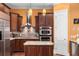 The kitchen features dark wood cabinets, granite countertops, stainless steel appliances, and pendant lighting at 396 15Th Nw St # 6, Atlanta, GA 30318