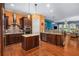 This spacious kitchen features dark wood cabinets, stainless steel appliances, and a large island at 396 15Th Nw St # 6, Atlanta, GA 30318