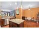 This kitchen features dark wood cabinets, granite countertops, stainless steel appliances, and an island at 396 15Th Nw St # 6, Atlanta, GA 30318